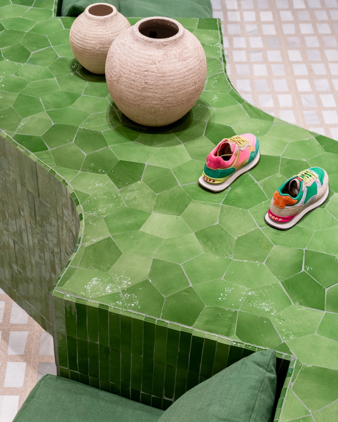 Shoe shop with zellige tiled sitting area and surfaces
